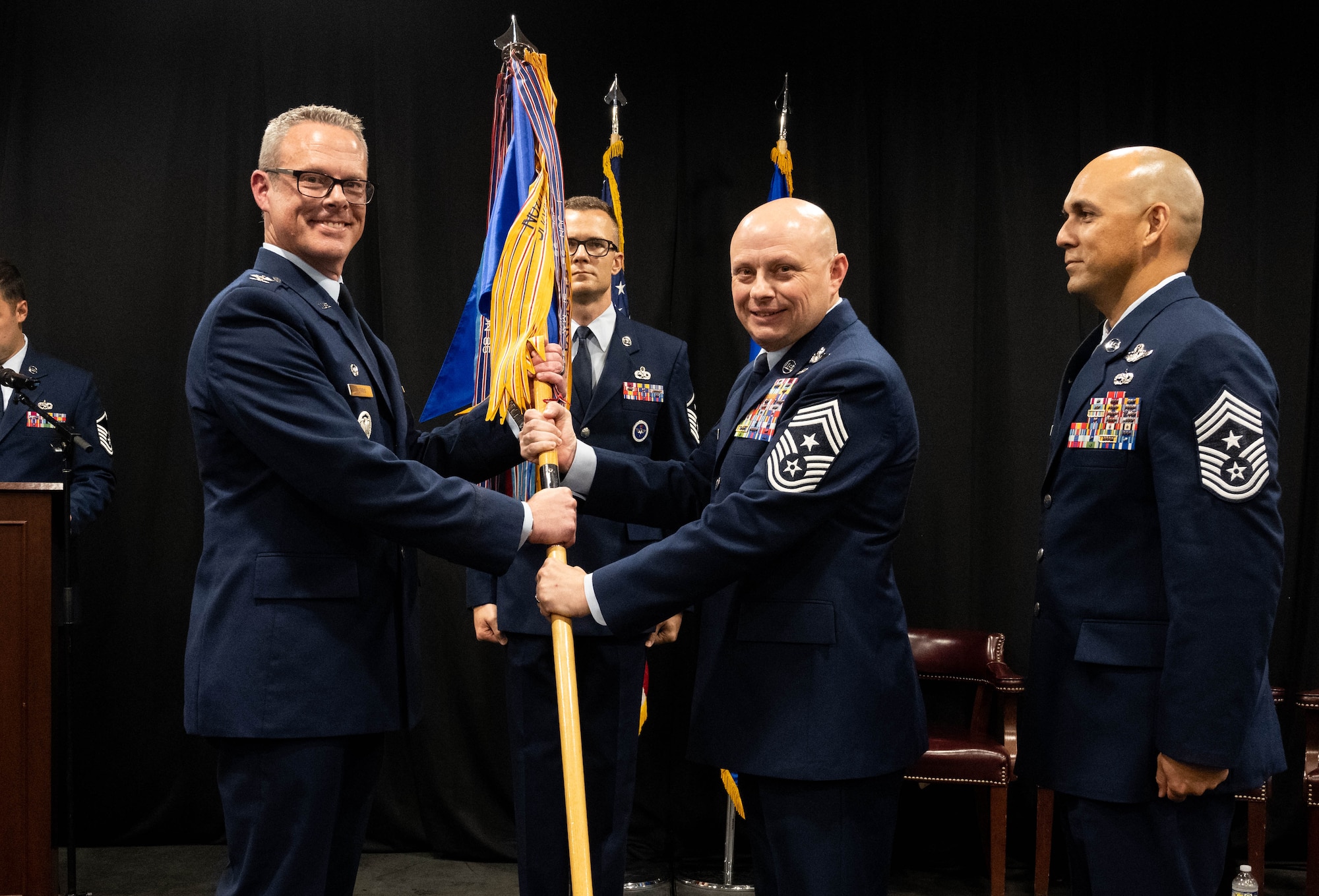 U.S. Airmen hold guidon