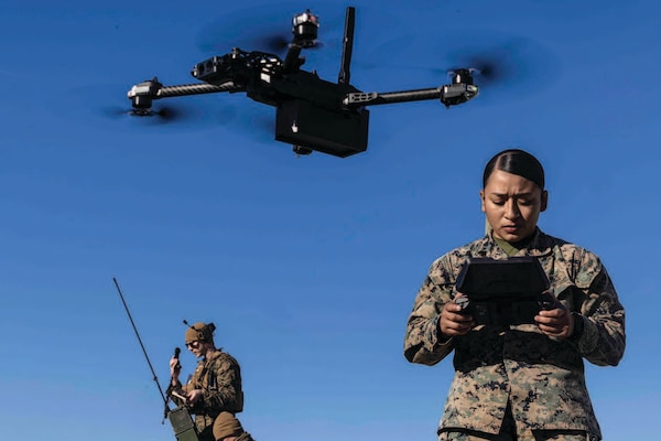 Marine Corps Sergeant Jacqueline Peguero-Montes, combat videographer with 24th Marine Expeditionary Unit, operates SkyDio unmanned aircraft system during fire support team exercise on Camp Lejeune, North Carolina, November 29, 2023