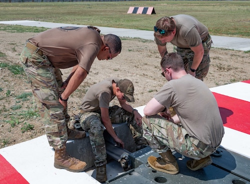 Airmen inspect a Barrier Arresting Kit-12