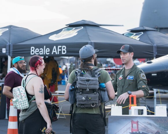U.S. Air Force Lt. Col Michael, 99th Reconnaissance Squadron commander, talks to 18th annual California Capital Airshow attendees about the T-38 Talon static display at Mather Airport, California, July 13, 2024