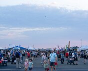 A crowd wanders between displays and performances at the 18th annual California Capital Airshow (CCA) at Mather Airport, California, July 13, 2024.