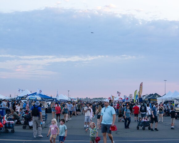 A crowd wanders between displays and performances at the 18th annual California Capital Airshow (CCA) at Mather Airport, California, July 13, 2024.