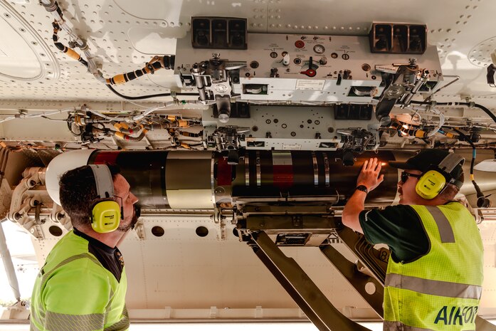 Air Force aviators from No. 11 Squadron, CPL Brendan King and CPL Zachary Sellman, fit a Mk54 Lightweight Exercise Torpedo to a Royal Australian Air Force P-8A Poseidon during Exercise Rim of the Pacific (RIMPAC) 2024, at Joint Base Pearl Harbor-Hickam, Hawaii.