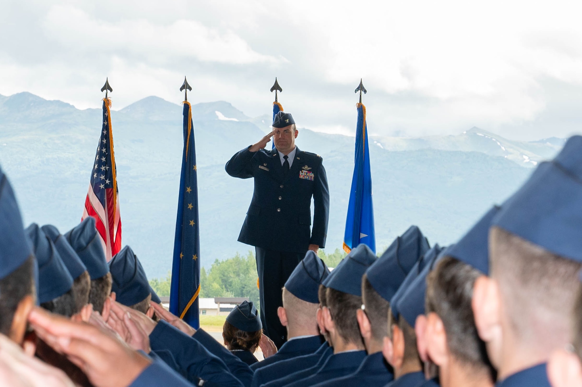 U.S. Air Force Col. Charles Schuck, the 3rd Wing commander, receives his first salute from a formation of 3rd Wing Airmen during his change of command ceremony at Joint Base Elmendorf-Richardson, Alaska, July 15, 2024.
