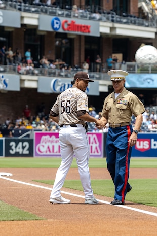 U.S. Marine Corps Col. Daniel Whitley, the deputy commander of Marine Corps Installations West Marine Corps Base Camp Pendleton, shakes the hand of Jeremiah Estrada, the San Diego Padres Pitcher during the Padres’ Military Salute to the Marine Corps at Petco Park Stadium, San Diego, July 14, 2024. U.S. Marines attended the Military Salute to the Marine Corps to honor the commitment of the U.S. Marines and connect with the San Diego community. (U.S. Marine Corps photo by Cpl. Mary Jenni)