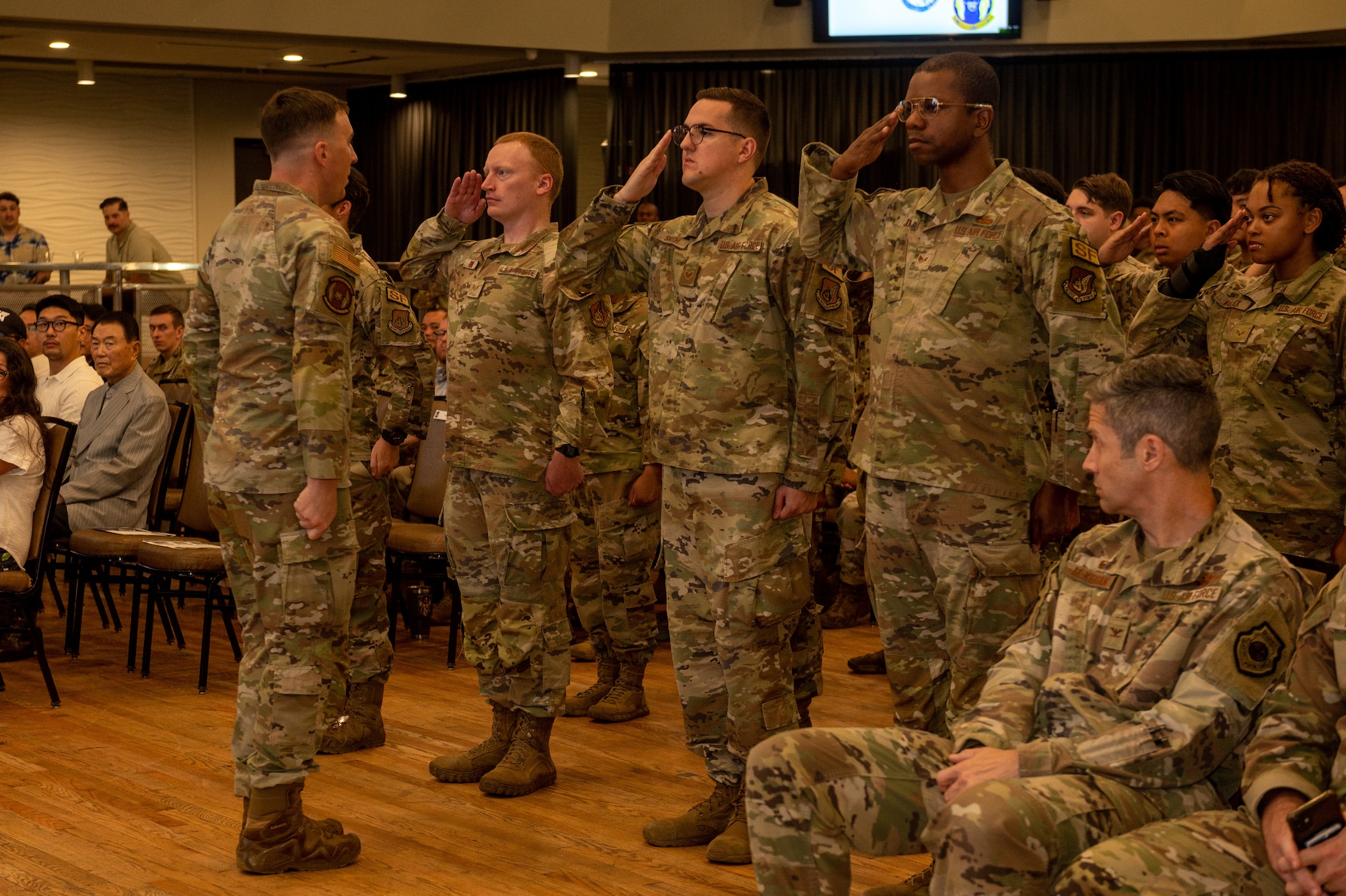 U.S. Air Force Airmen assigned to the 51st Security Forces Squadron render their first salute to Lt. Col. Daniel Evans, 51st Security Forces Squadron commander, during a change of command ceremony at Osan Air Base, Republic of Korea, June 12, 2024. A change of command ceremony, which dates back as far as the Roman empire, marks the transition of responsibility from one military leader to another into a real, tangible act, solidifying the continuity of leadership and affirming the formal nature of professional military service for all present. (U.S. Air Force photo by Senior Airman Kaitlin Frazier)