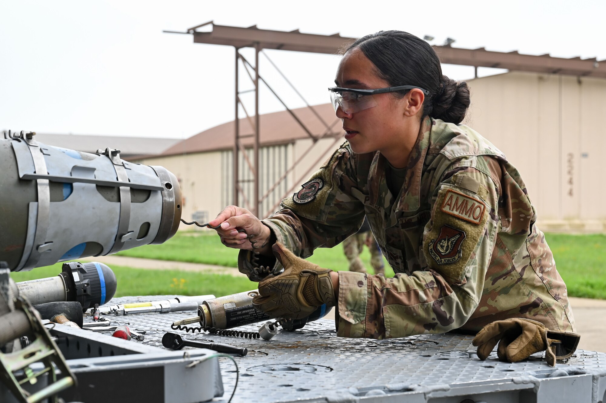 Senior Airman Sarai Perez, 8th Maintenance Squadron conventional maintenance technician, prepares a munition for loading during the 2024 2nd Quarter Dedicated Crew Chief and Load Crew Competition.