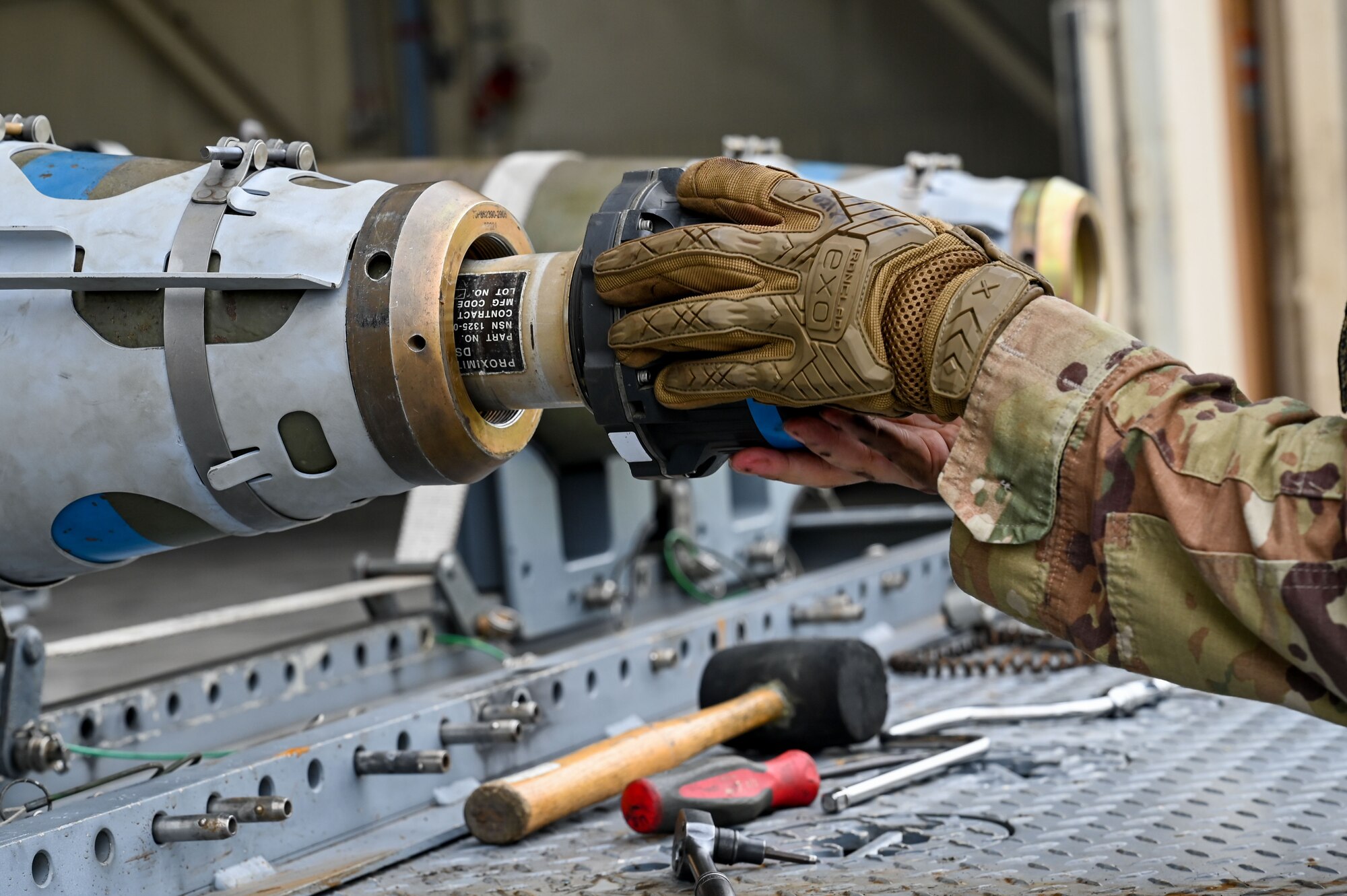 Senior Airman Sarai Perez, 8th Maintenance Squadron conventional maintenance technician, prepares a munition for loading during the 2024 2nd Quarter Dedicated Crew Chief and Load Crew Competition.