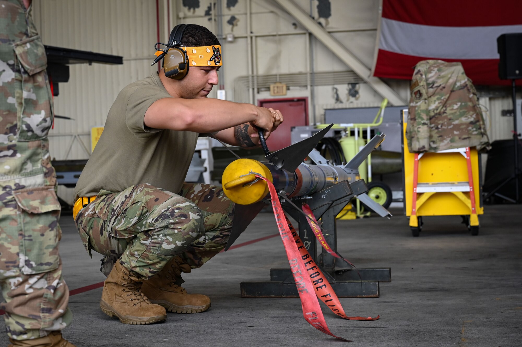 Senior Airman Nicholas Velazquez, 80th Fighter Generation Squadron weapons loader, prepares a munition during the 2024 2nd Quarter Dedicated Crew Chief and Load Crew Competition.
