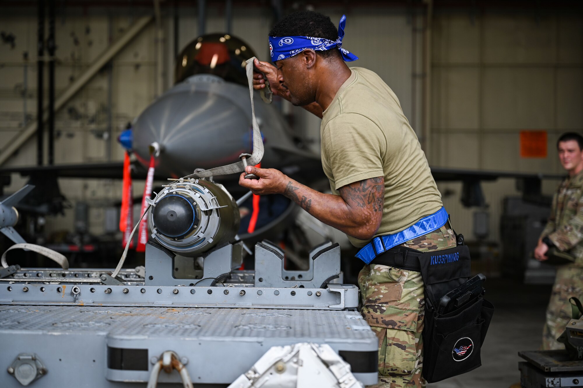 U.S. Air Force Staff Sgt. Michael Holloway, 35th Fighter Generation Squadron weapons crew team chief, prepares a munition during the 2024 2nd Quarter Dedicated Crew Chief and Load Crew Competition.