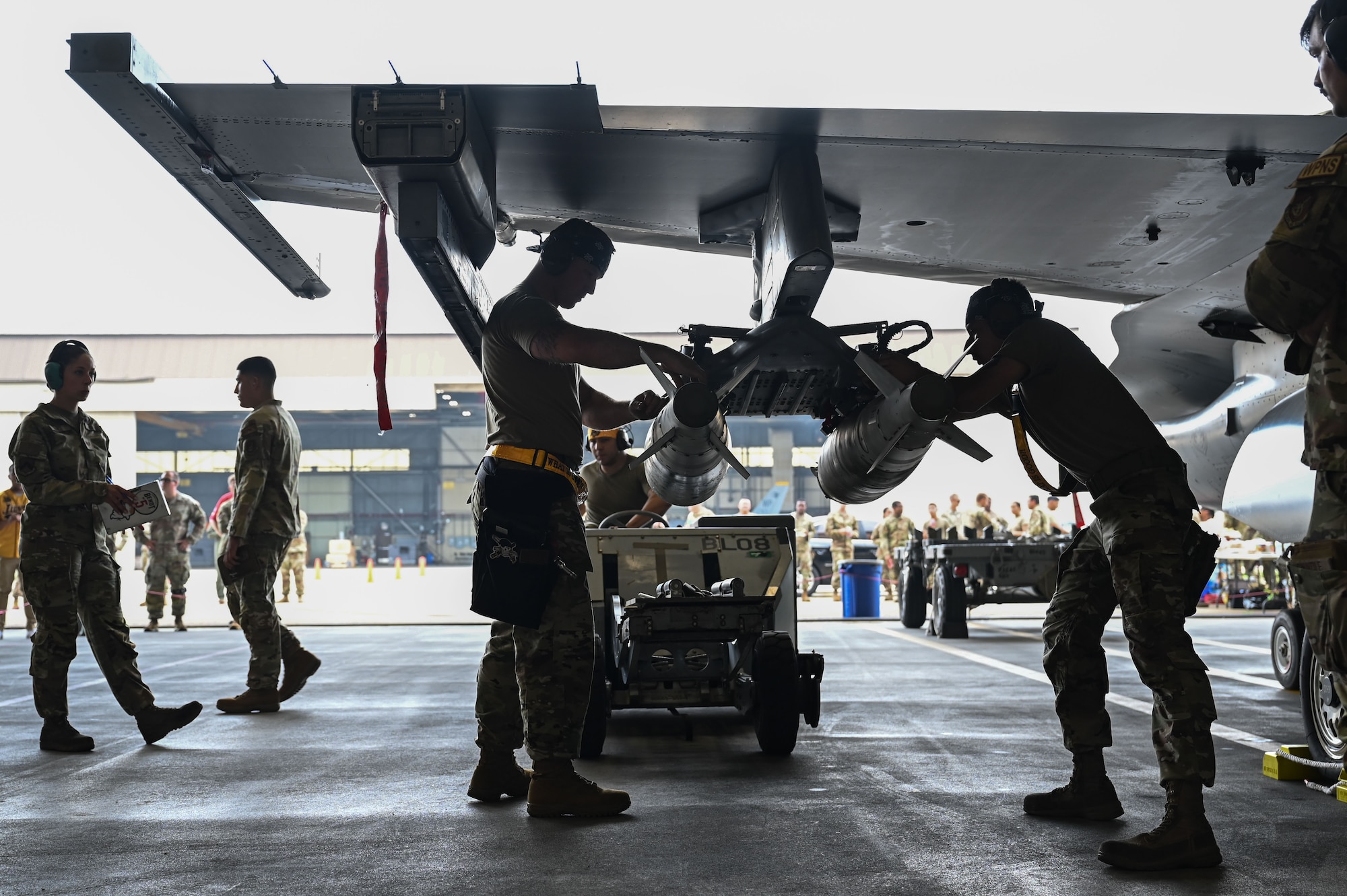 Members assigned to the 80th Fighter Generation Squadron load munitions during the 2024 2nd Quarter Dedicated Crew Chief and Load Crew Competition.
