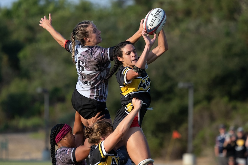 Army 1st Lt. Cienna Jordan, right, and Air Force Capt. Katie Mueller battle for a ball during the 2024-Armed Forces Women’s Rugby Championships held in conjunction with the San Diego Surfers Women’s Rugby Club 7’s Tournament in San Diego, Calif. from July 12. (DoD photo by EJ Hersom)