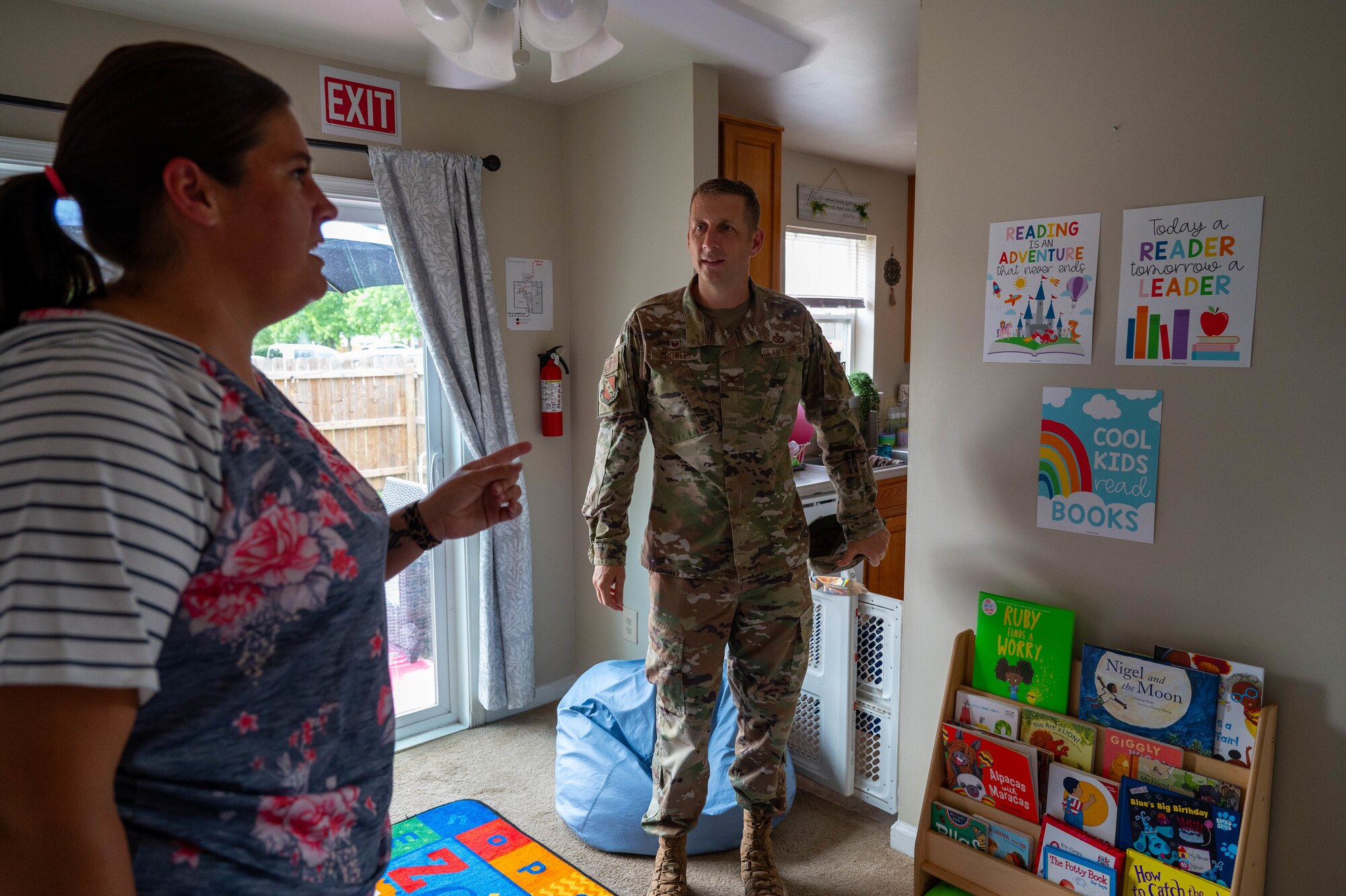 Krista Cox, a Family Child Care provider, gives a tour of her home to U.S. Air Force Col. Ryan A. F. Crowley, commander of Joint Base Anacostia-Bolling and the 11th Wing, following the opening of the newest Family Child Care home at JBAB, Washington, D.C., July 10, 2024. Safety is a top priority of the Family Child Care program because providers are inspected throughout the year by multiple official installation offices to ensure they are complying with Department of Defense standards. (U.S. Air Force photo by Hayden Hallman)