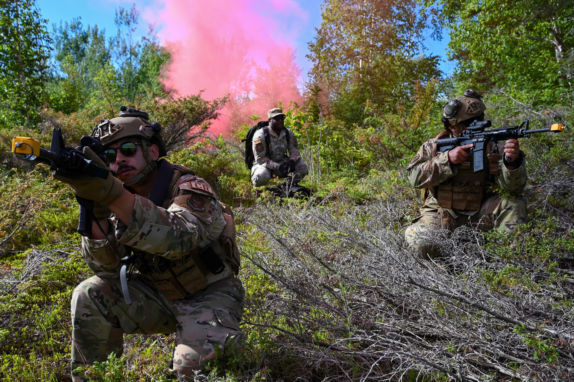 Staff Sgt. Virgil Salidavar, left, 433rd Contingency Response Flight specialist, Senior Airman Isaac Williams, center, 72nd Healthcare Operations Squadron technician, and the CR team implemented a casualty evacuation procedure during battle drills at the Contingency Location Operations Rehearsal (CLOR 24) at the Combat Readiness Training Center in Alpena, Michigan June 27, 2024.