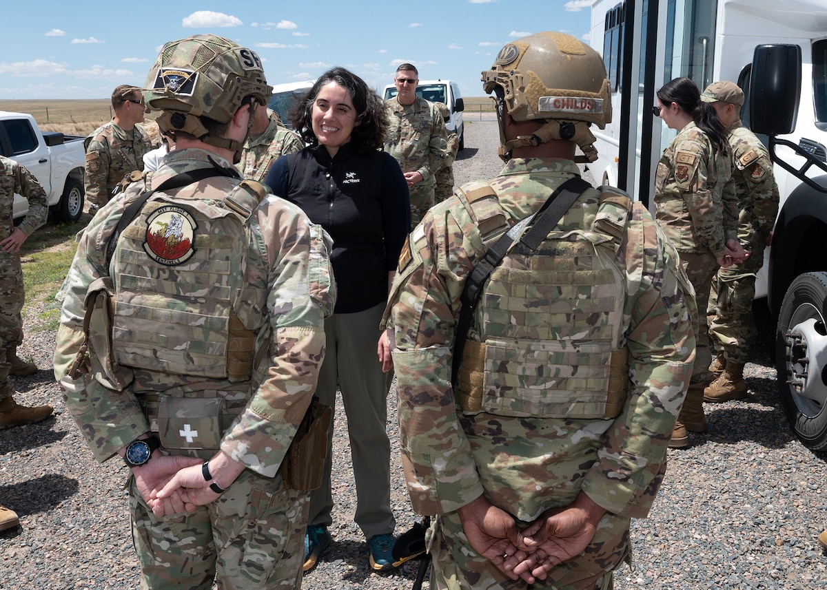 Senior Airman Junious Powers and Staff Sgt. Kenneth Childs, defenders from the 90th Missile Security Forces Squadron, give a briefing to Under Secretary of the Air Force Melissa Dalton at the A-06 launch facility near Egbert, Wyoming, July 2, 2024. Dalton visited the 90th Missile Wing at F.E. Warren Air Force Base, Wyoming, and the missile field to witness how Airmen continue to provide 24/7 strategic deterrence, standing ready to respond at a moment’s notice in support of the most responsive leg of the nuclear triad. (U.S. Air Force photo by Glenn S. Robertson)