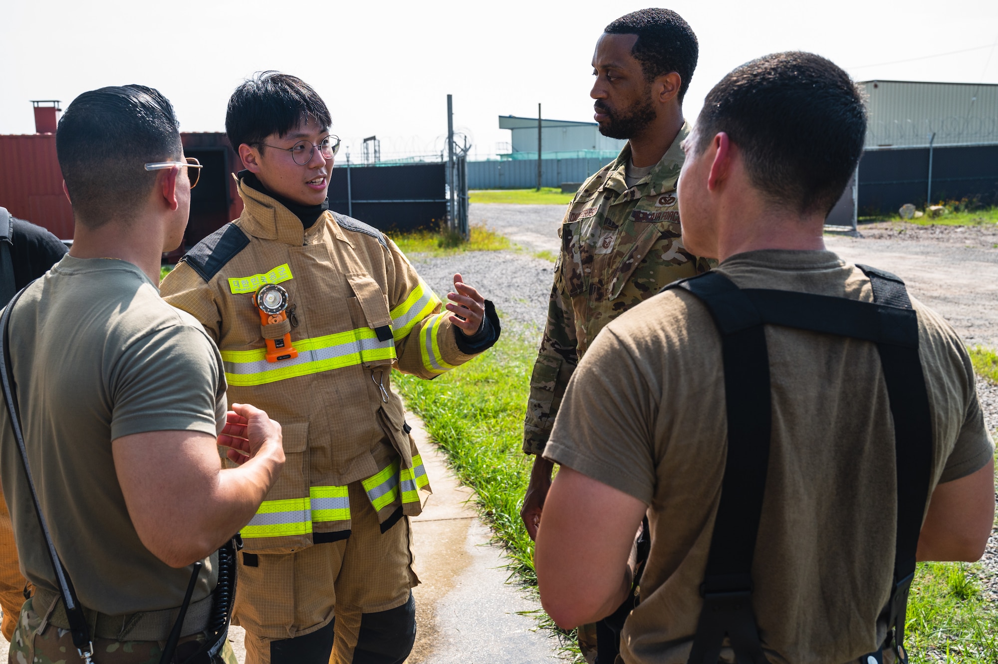 Yho-han La, a Korea Air Space University material science and engineering major, speaks with members of the 8th Civil Engineer Squadron