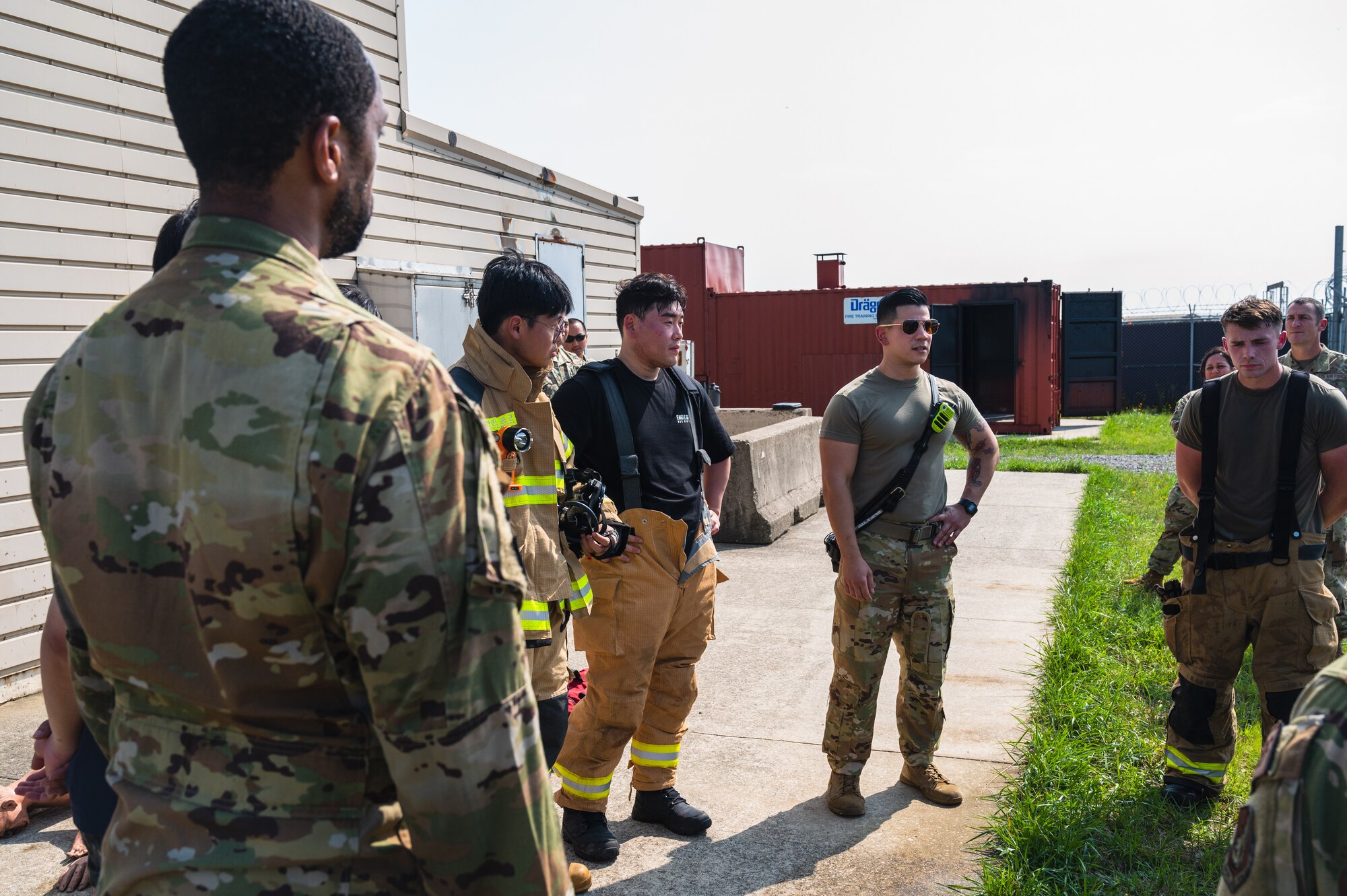 Airmen from the 8th Civil Engineer Squadron and members from the 38th Force Protection Squadron Republic of Korea Air Force conduct an after-action discussion