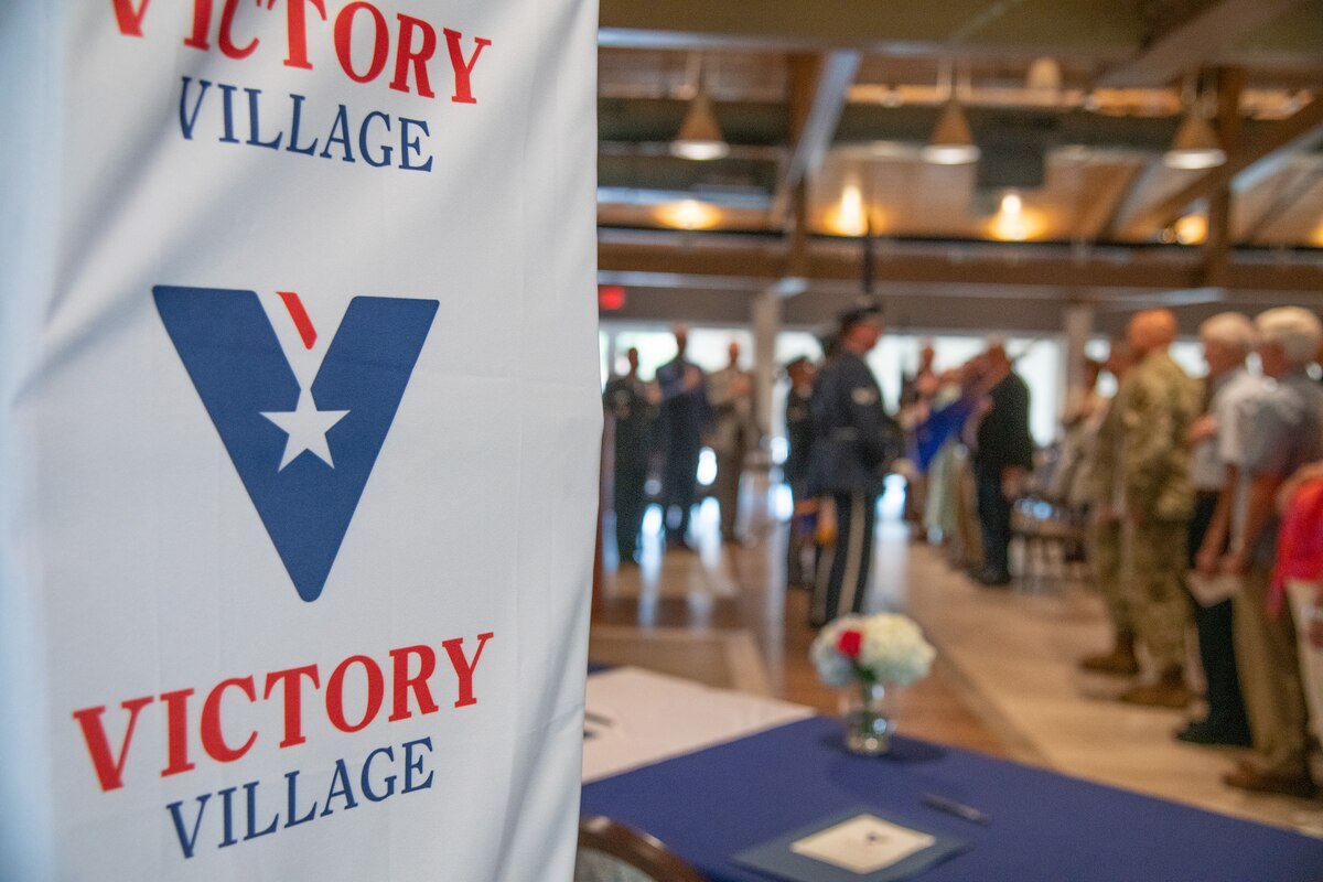 Residents of the Air Force Enlisted Village and guests attend the deed signing ceremony commemorating the purchase 80 acres of land from Eglin Air Force Base, Fla., held at the Bob Hope Village Commons July 12, 2024.