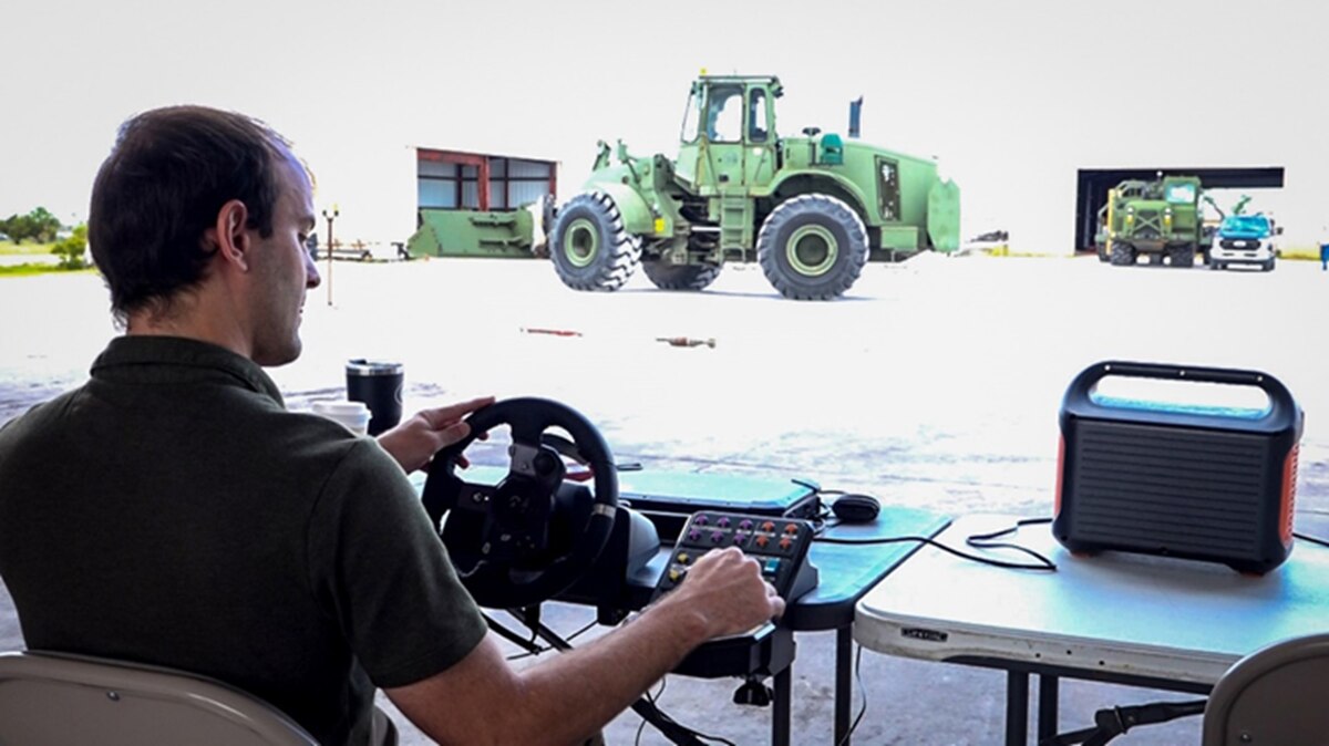 Collin Hays operates an unmanned armored loader