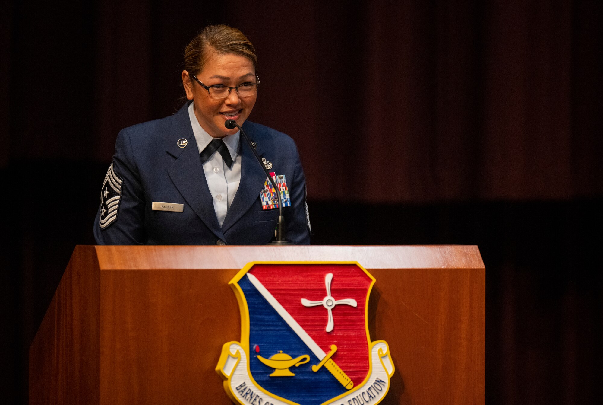 Chief Master Sgt. Bridget Bruhn gives her first remarks to the unit after becoming the Thomas N. Barnes Center for Enlisted Education command chief during a change of responsibility ceremony on Maxwell Air Force Base, Gunter Annex, Alabama, July 12, 2024. (U.S. Air Force photo/Brian Ferguson)