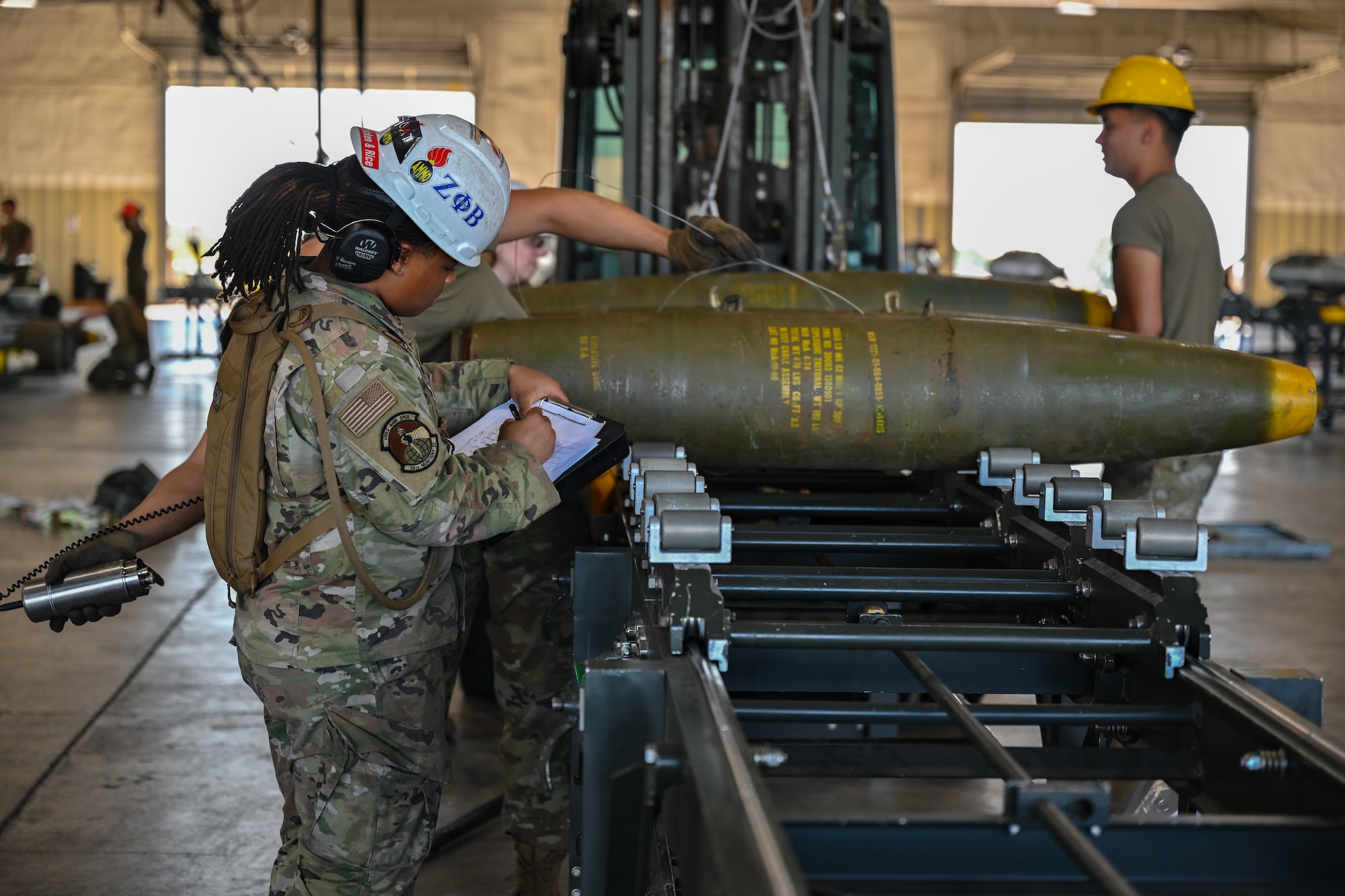 U.S. Air Force Senior Airman Tatyana Guidry, 28th Munitions Squadron conventional maintenance instructor, performs quality checks on a GBU-38 munition during a Combat Ammunition Production Exercise at Ellsworth Air Force Base, S.D., July 9, 2024. CAPEX is designed to prepare munitions Airmen for future deployments and home station contingency taskings by simulating sustained combat operations. (U.S. Air Force photo by Staff Sgt. Jake Jacobsen)