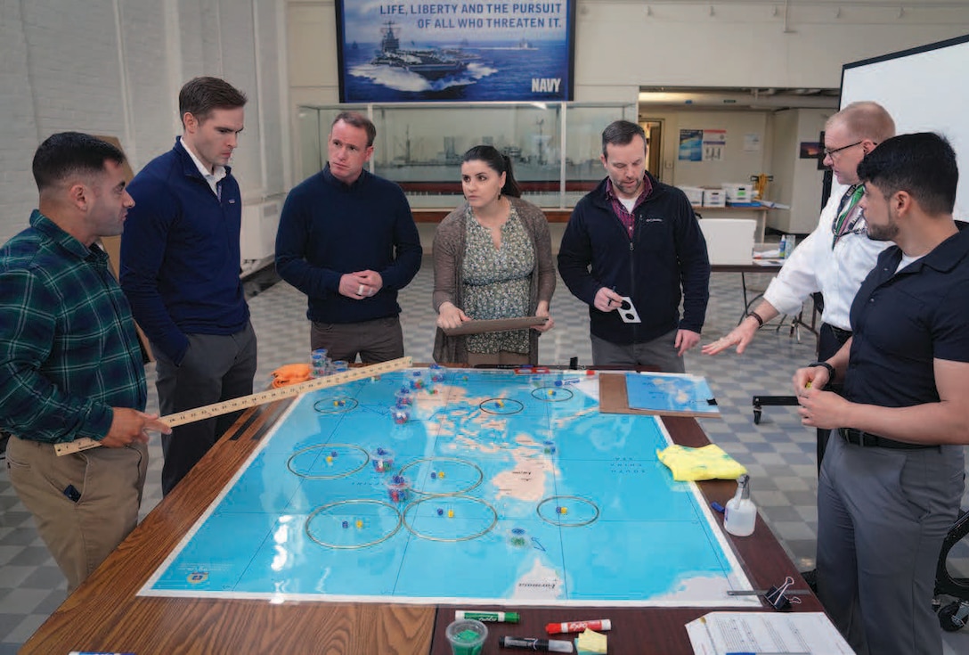 Students and faculty practice complex war scenarios as part of U.S. Naval War College War Gaming Department.