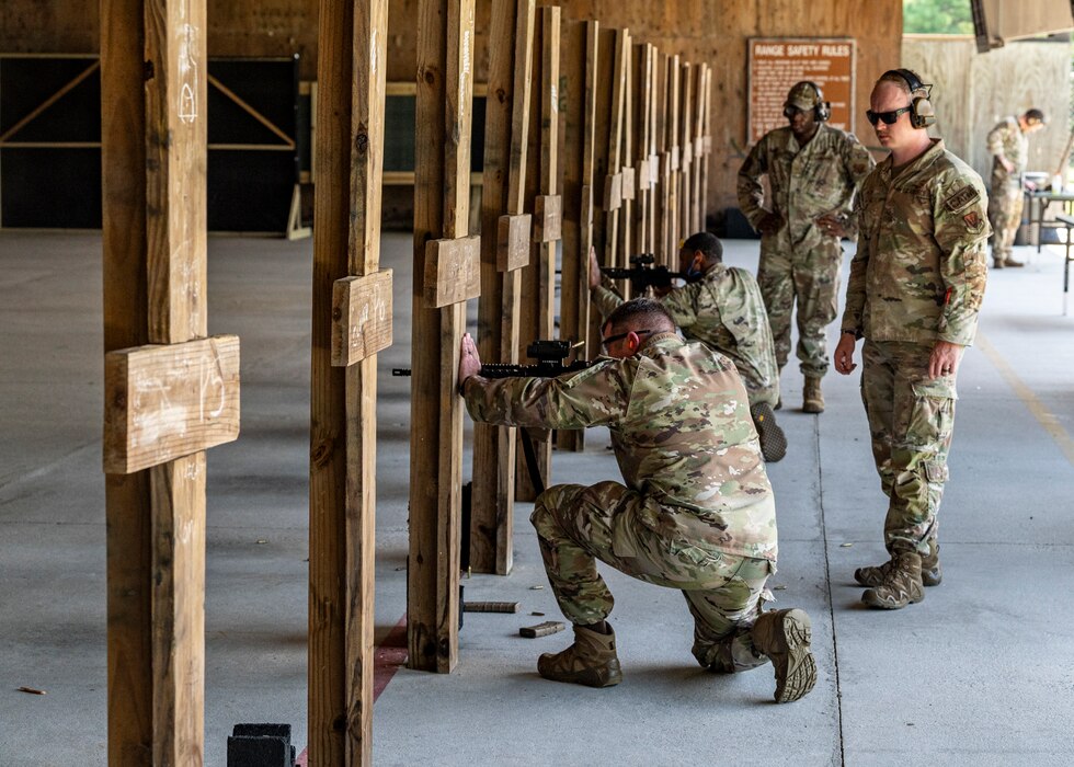 U.S. Air Force Col. Paul Sheets, 23rd Wing commander, and U.S. Chief Master Sgt. Harold Davis, 41st Rescue Generation Squadron senior enlisted leader, fire M4 carbines at Moody Air Force Base, Georgia, July 12, 2024. Sheets and Davis were able to fire multiple weapon systems under the watchful eye of Airmen from the 820th Combat Operations Squadron. Battlefield circulations allow the base senior leaders to visit different units to learn about the work the Airmen do and get a true picture of how they operate in their day-to-day duties. (U.S. Air Force photo by Airman 1st Class Leonid Soubbotine)