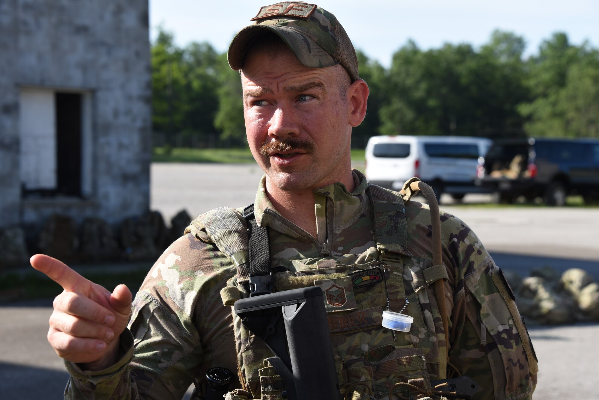 Master Sgt. Mitch Treiber, 185th Air Refueling Wing Security Forces, points while speaking