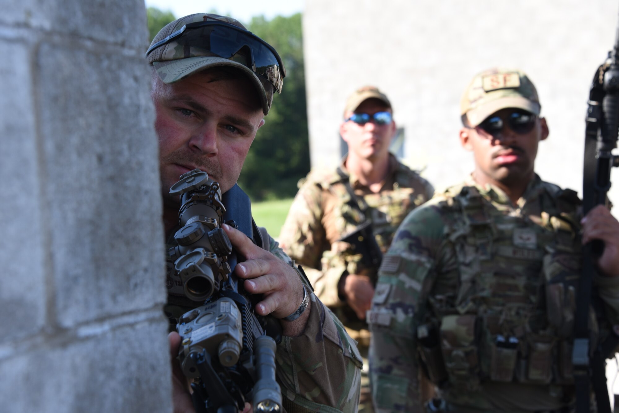 Tech. Sgt. Jacob Bergman, 185th Air Refueling Wing Security Forces, leans around a corner with a rifle