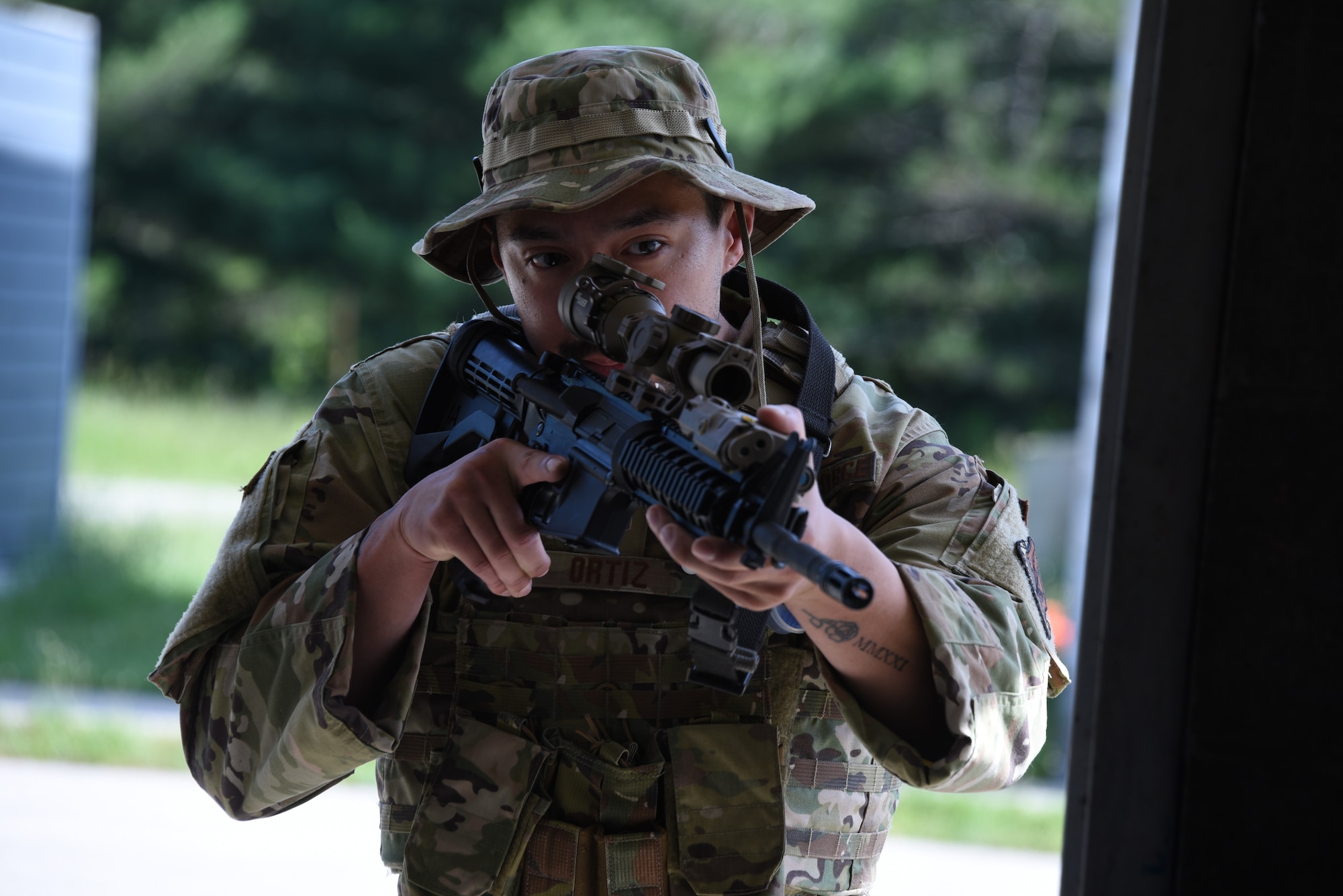 Tech. Sgt. Erick Ortiz, a 132nd Wing Security Forces fireteam leader, practices entering a building