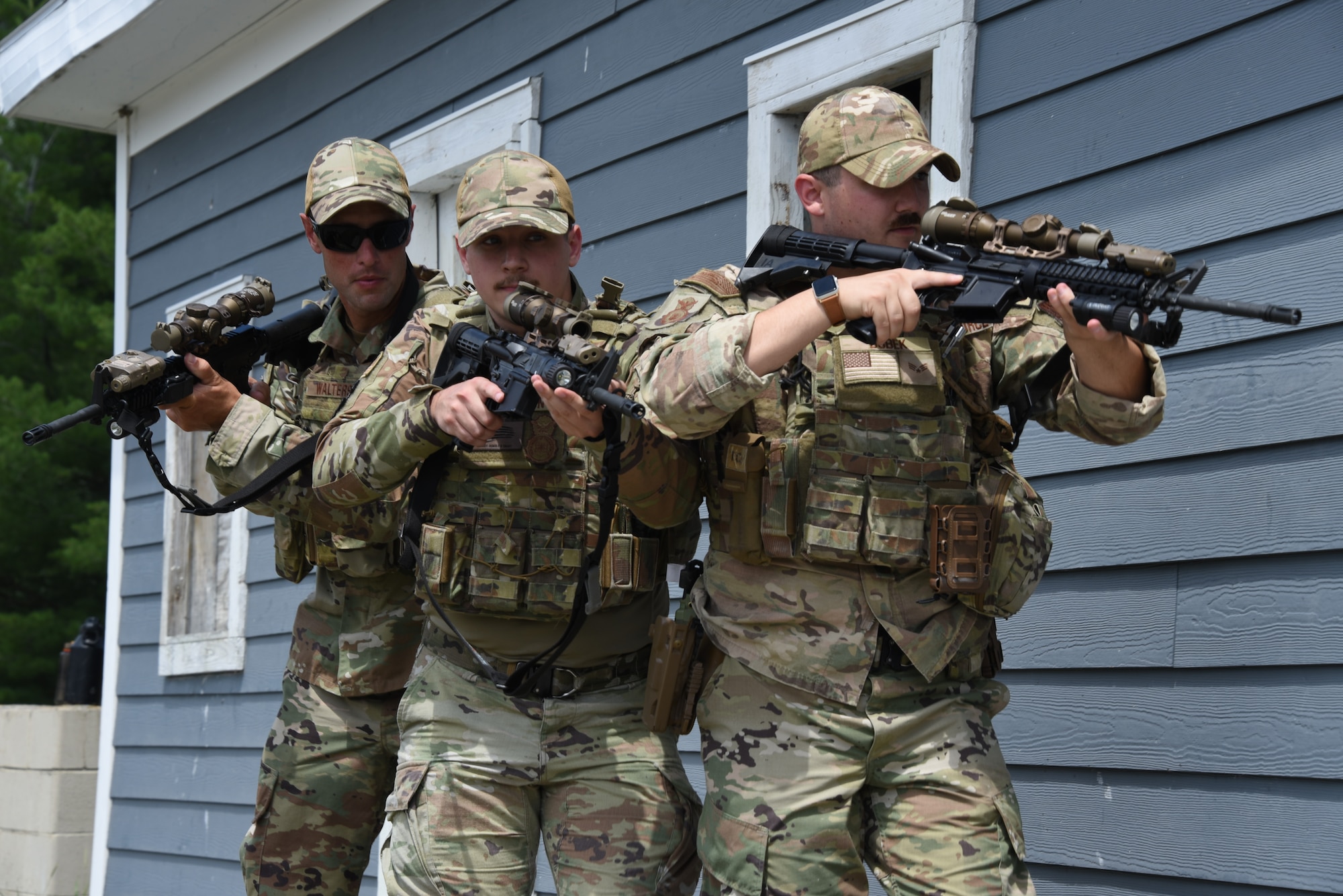 Senior Airman Justin Dobek, 132nd Security Forces, right, Staff Sgt. Anthony Plesnicar 132nd Wing Security Forces, center, Master Sgt. Andy Walters, a 132nd Wing Security Forces Flight Chief, left, practice stacking up next to an entryway