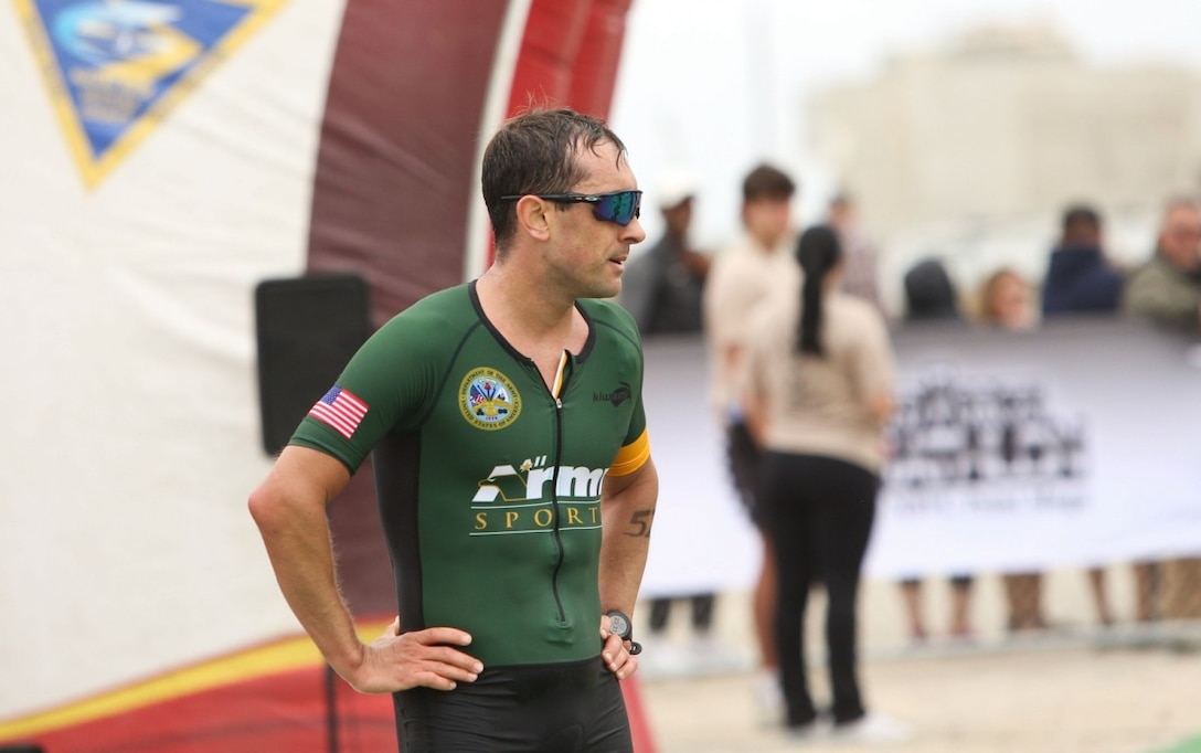 Maj. Nicholas Sterghos, a member of the Army Reserve, catches his breath after finishing 4th in the 2024 Armed Forces Triathlon Championship on July 29 at Point Mugu Beach, Calif. (Master Sgt. Sharilyn Wells)