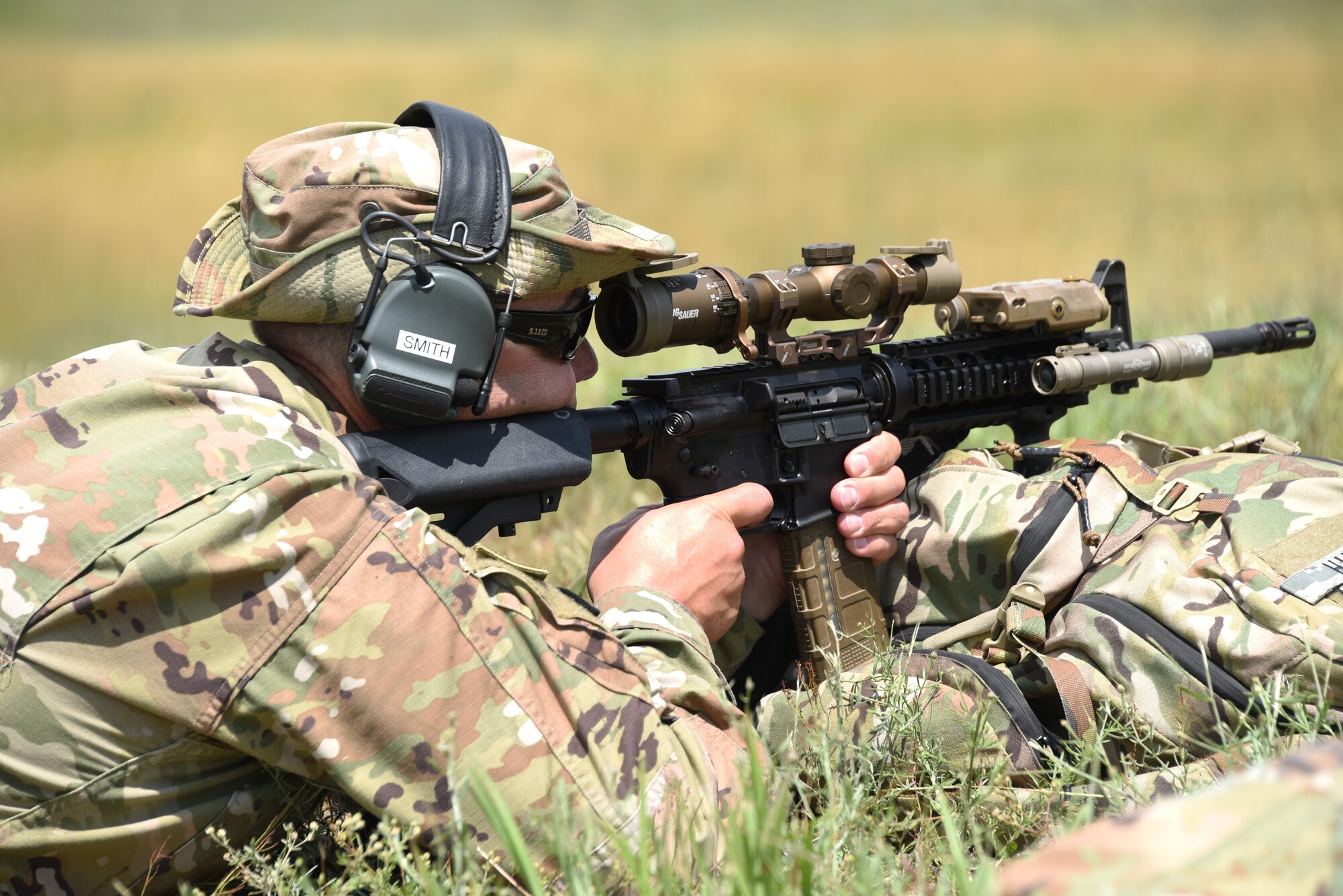 Master Sgt. Eric Smith, a 185th Air Refueling Wing Security Forces flight chief, aims from an M4A1 rifle while prone at a range