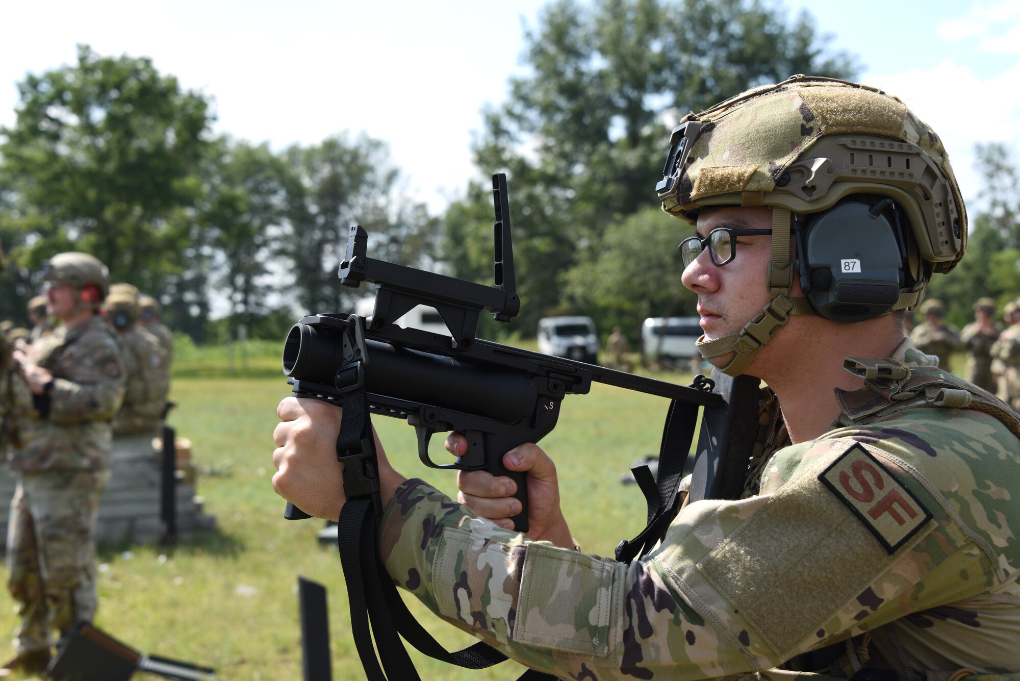 Airman Basic Trey Kooker, 185th Air Refueling Wing Security Forces, aims a M320 grenade launcher at a range