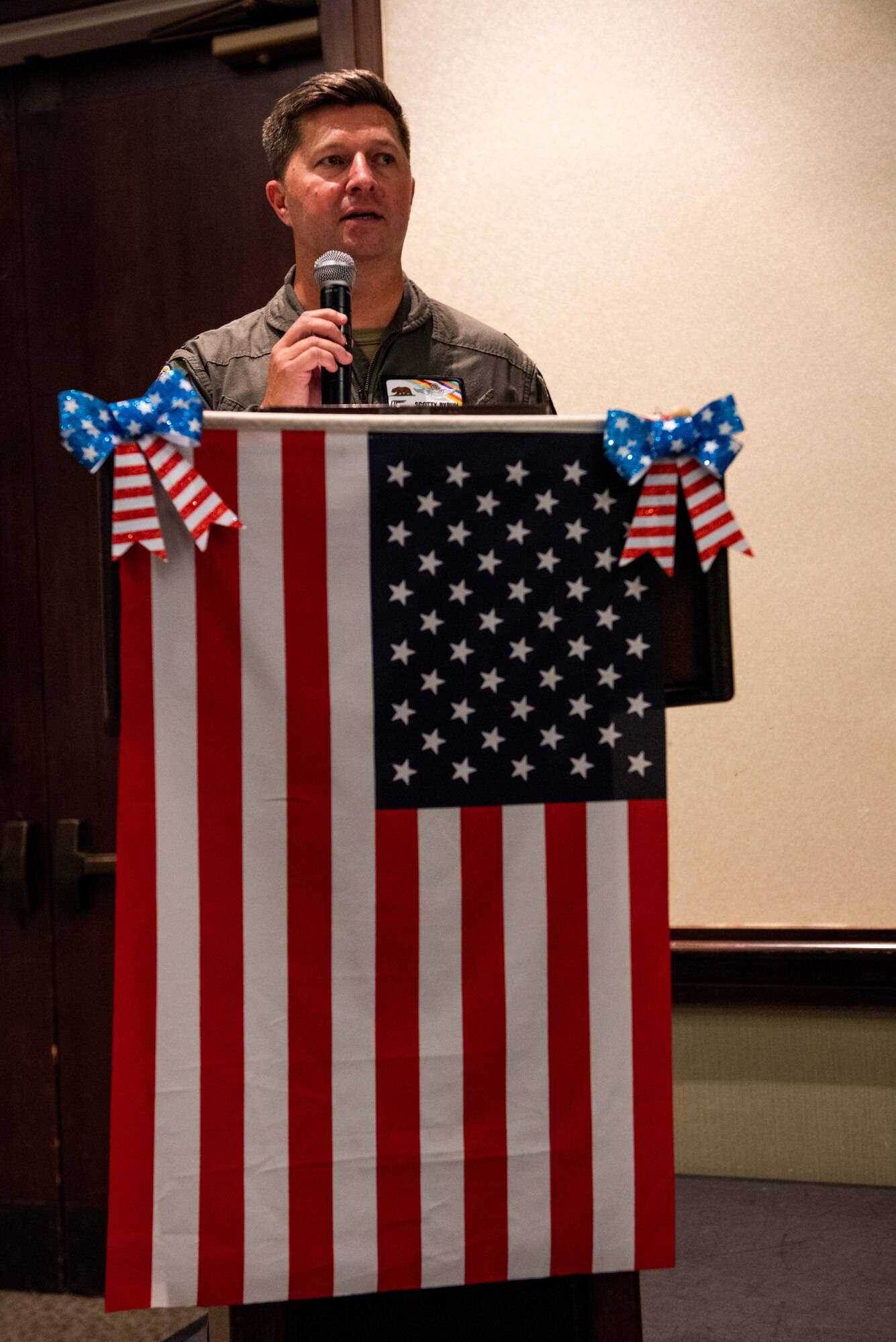 Deputy commander delivering congratulatory remarks.