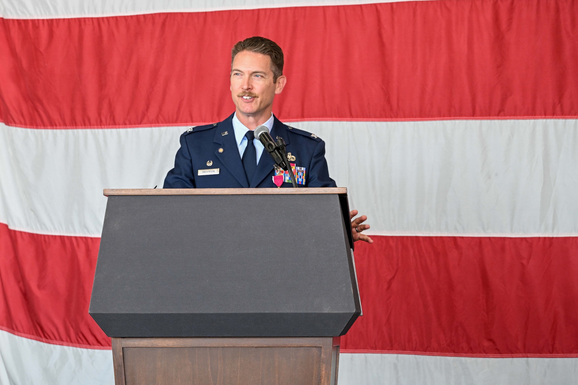a photo of an Air Force officer in uniform behind a podium