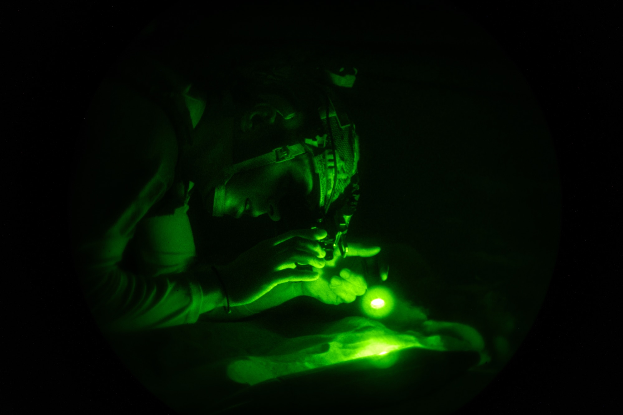 1st. Sgt. Akakios Pelekanos, 70th Combat Engineer Battalion of the National Guard of the Republic of Cyprus explosive ordnance disposal team technician, utilizes night vision goggles to locate and assess a variety of simulated explosives June 7, 2024, on Joint Base McGuire-Dix-Lakehurst, New Jersey.