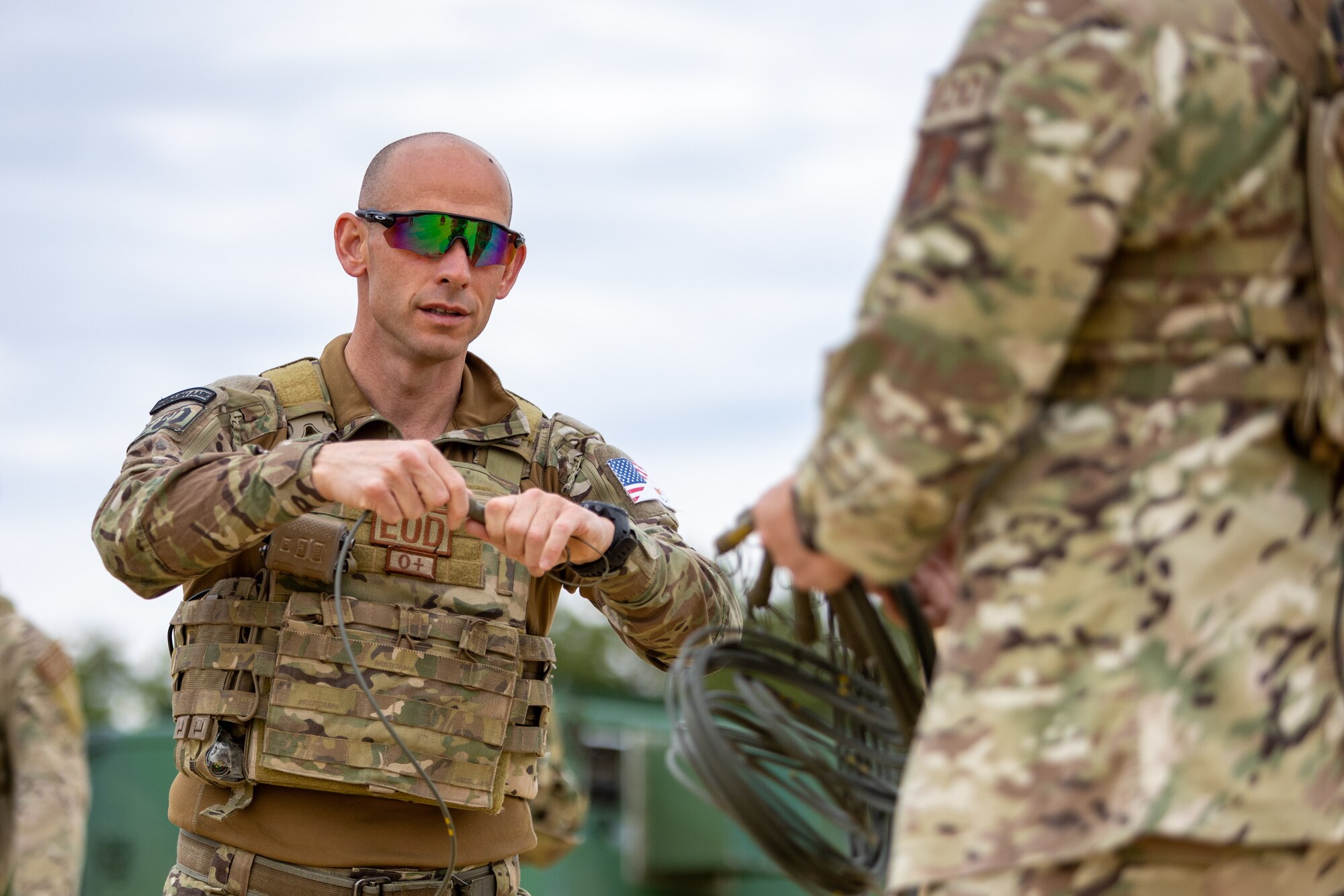National Guard of the Republic of Cyprus 1st Sgt. Nicolas Miltiadous, Explosive Ordnance Disposal (EOD) technician assigned to the 70th Combat Engineer Battalion, prepares small explosive charges for detonation with 177th Civil Engineering Squadron EOD team at the Warren Grove Gunnery Range, Warren Grove, New Jersey, June 11, 2024.