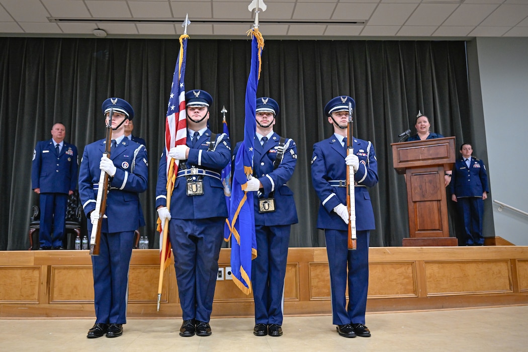 Four Air Force Base Honor Guardsmen post the colors.