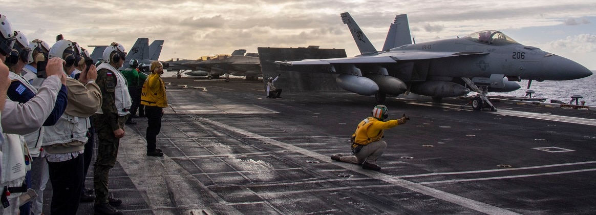 U.S. Congressional delegates and partner nation military members observe flight operations aboard Nimitz-class aircraft carrier USS Carl Vinson (CVN 70) as the ship participates in the at-sea phase of Exercise Rim of the Pacific (RIMPAC) 2024.