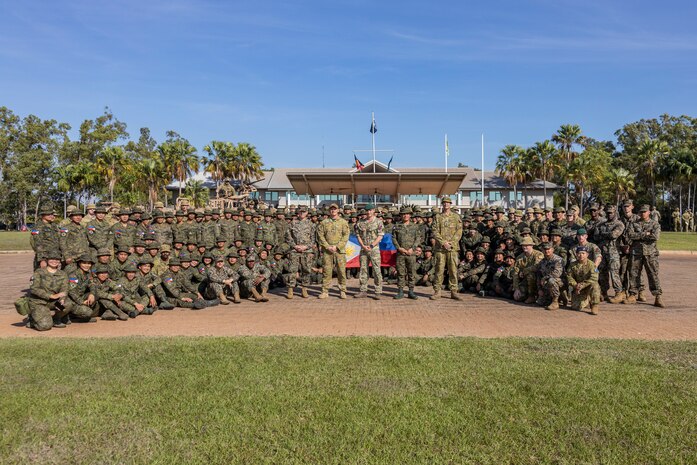 Service members from the United States, Australia, the Republic of the Philippines, and the United Kingdom, pose for a photo after the opening ceremony of Exercise Predator’s Run 24 at Robertson Barracks, NT, Australia, July 15, 2024.
