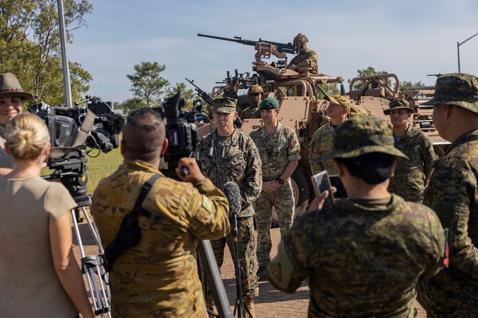 Service members from the United States, Australia, the Republic of the Philippines, and the United Kingdom, participate in media interviews after the opening ceremony of Exercise Predator’s Run 24 at Robertson Barracks, NT, Australia, July 15, 2024.