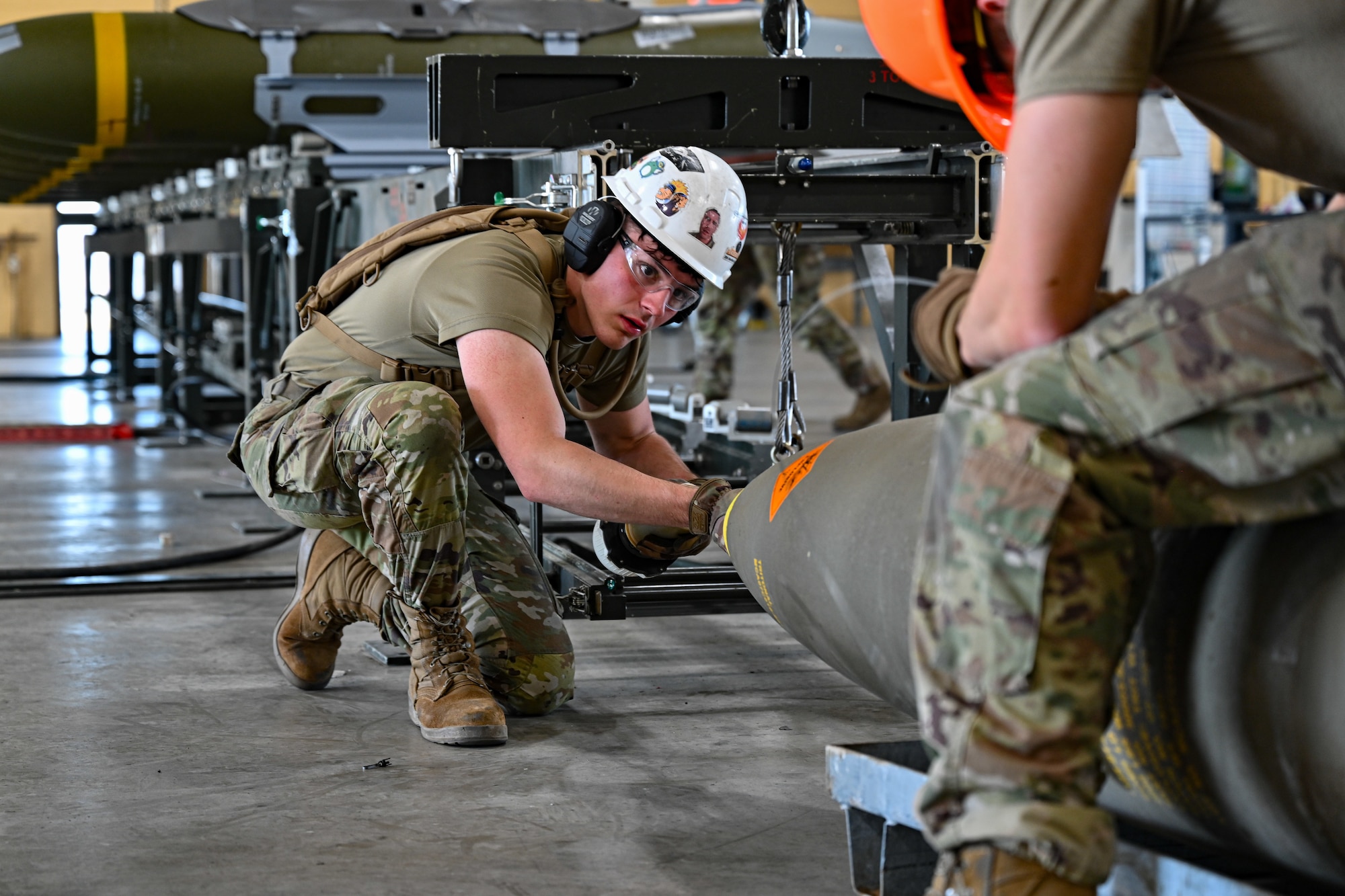 U.S. Air Force Senior Airman Trevor Jones, 28th Munitions Squadron conventional maintenance crew chief, assembles a GBU-31 munition during a Combat Ammunition Production Exercise at Ellsworth Air Force Base, S.D., July 9, 2024. During CAPEX, Airmen practice rapid weapons production during simulated sustained combat operations. (U.S. Air Force photo by Staff Sgt. Jake Jacobsen)