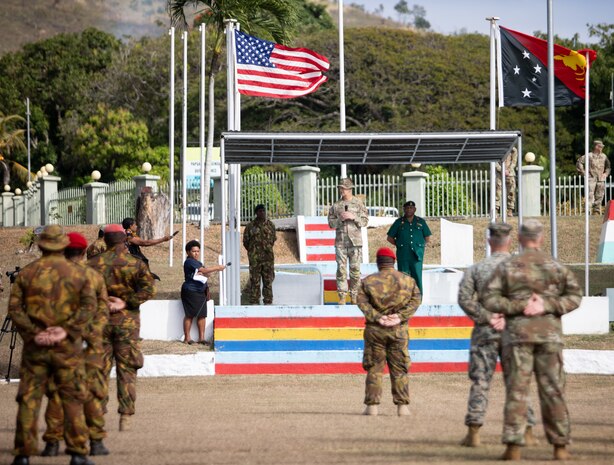 U.S. Army Lt. Gen. James Jarrard, the deputy commanding general of U.S. Army Pacific, center left, gives opening remarks to U.S. Army Soldiers assigned to U.S. Army Pacific, and Papua New Guinea Defense Force soldiers, while Papua New Guinea Defense Force Col. Kingsley Wawada, the PNGDF support services commander, center right, observes the formation during the Tamiok Strike opening ceremony July 15, 2024, Murray Barracks, Papua New Guinea. T