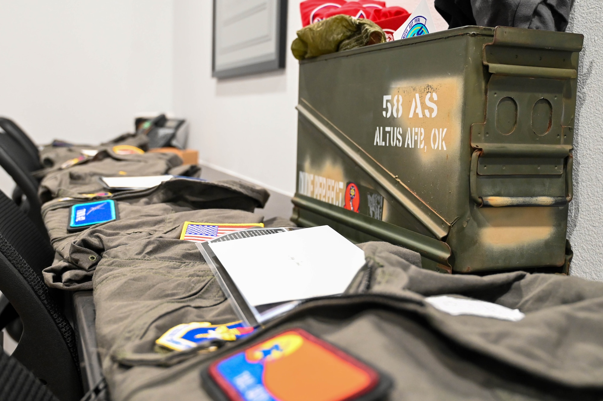 Flight suits from the 97th Air Mobility Wing for the members of Dude Perfect lay on a countertop at Altus Air Force Base, Oklahoma, June 11, 2024. This project was an opportunity to showcase the thrilling blend of the Air Force’s precision and the Dudes’ adventurous spirit. (U.S. Air Force photo by Senior Airman Trenton Jancze)