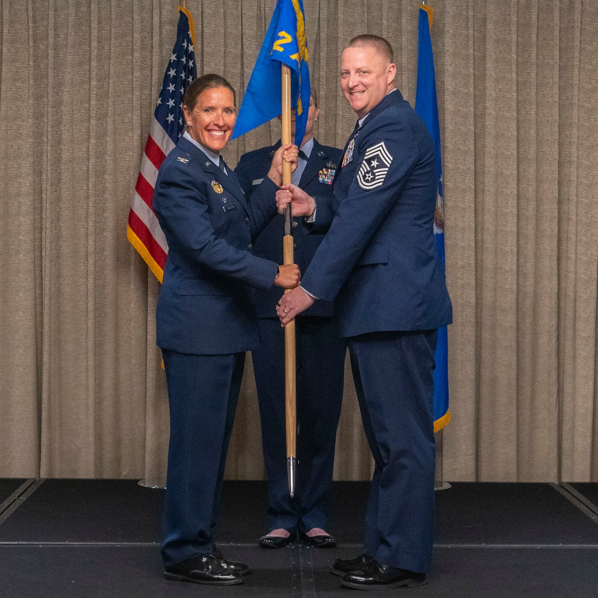 man receives guidon