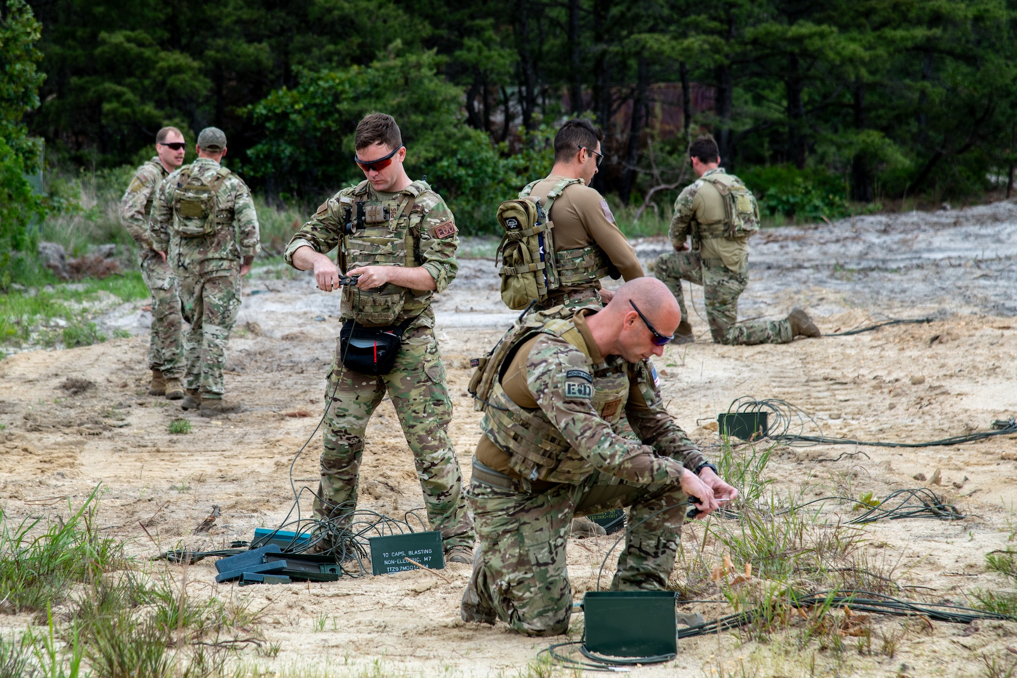 U.S. Air Force 177th Civil Engineers Squadron Explosive Ordnance Disposal team technicians and 70th Combat Engineer Battalion of the National Guard of the Republic of Cyprus EOD technicians, prepare explosive charges for detonation June 11, 2024, at the Warren Grove Gunnery Range, Warren Grove, New Jersey.
