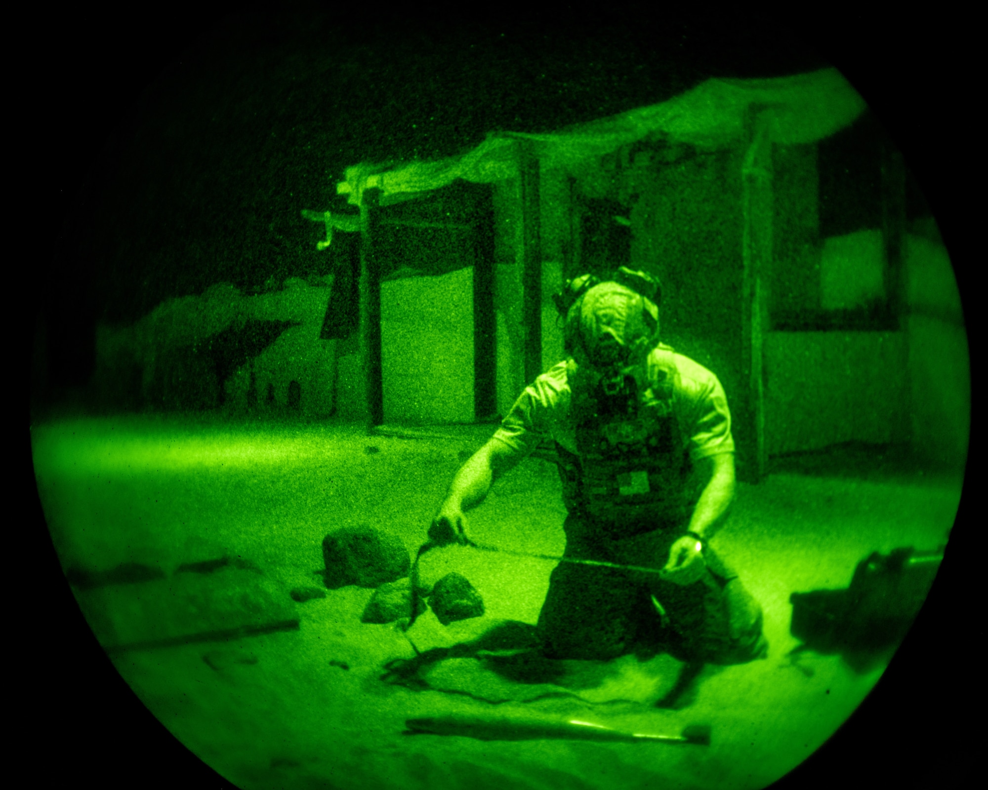 1st. Sgt. Akakios Pelekanos, 70th Combat Engineer Battalion of the National Guard of the Republic of Cyprus explosive ordnance disposal team technician, utilizes night vision goggles to locate and assess a variety of simulated explosives June 7, 2024, on Joint Base McGuire-Dix-Lakehurst, New Jersey.