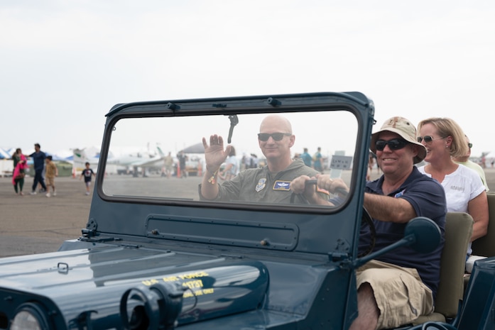 commander waving at the camera