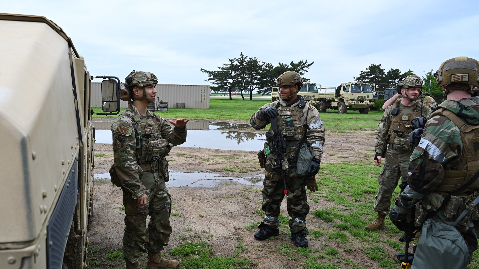 Senior Airman Timothy Kline, left, 8th Security Forces Squadron vehicle control officer, leads chemical, biological, radioactive, nuclear driving training during Beverly Sentinel 24-2 at Kunsan Air Base, Republic of Korea